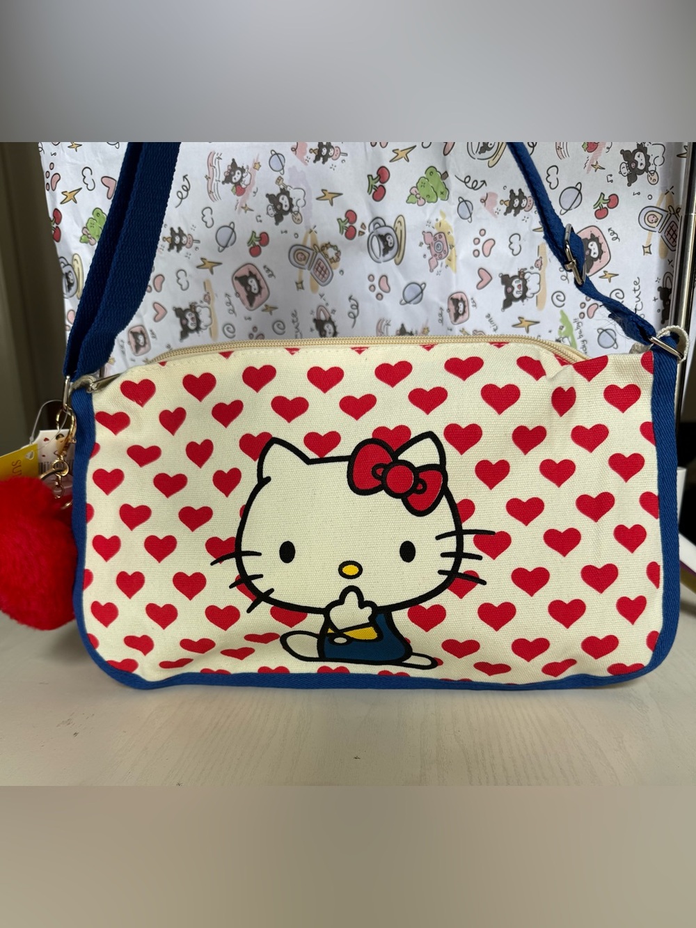 Hello Kitty Canvas Crossbody Bag in Red, Blue, Cream with Plush Red Heart Charm - Picture 4 of 8